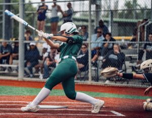 Calvary Softball team member batting during a game